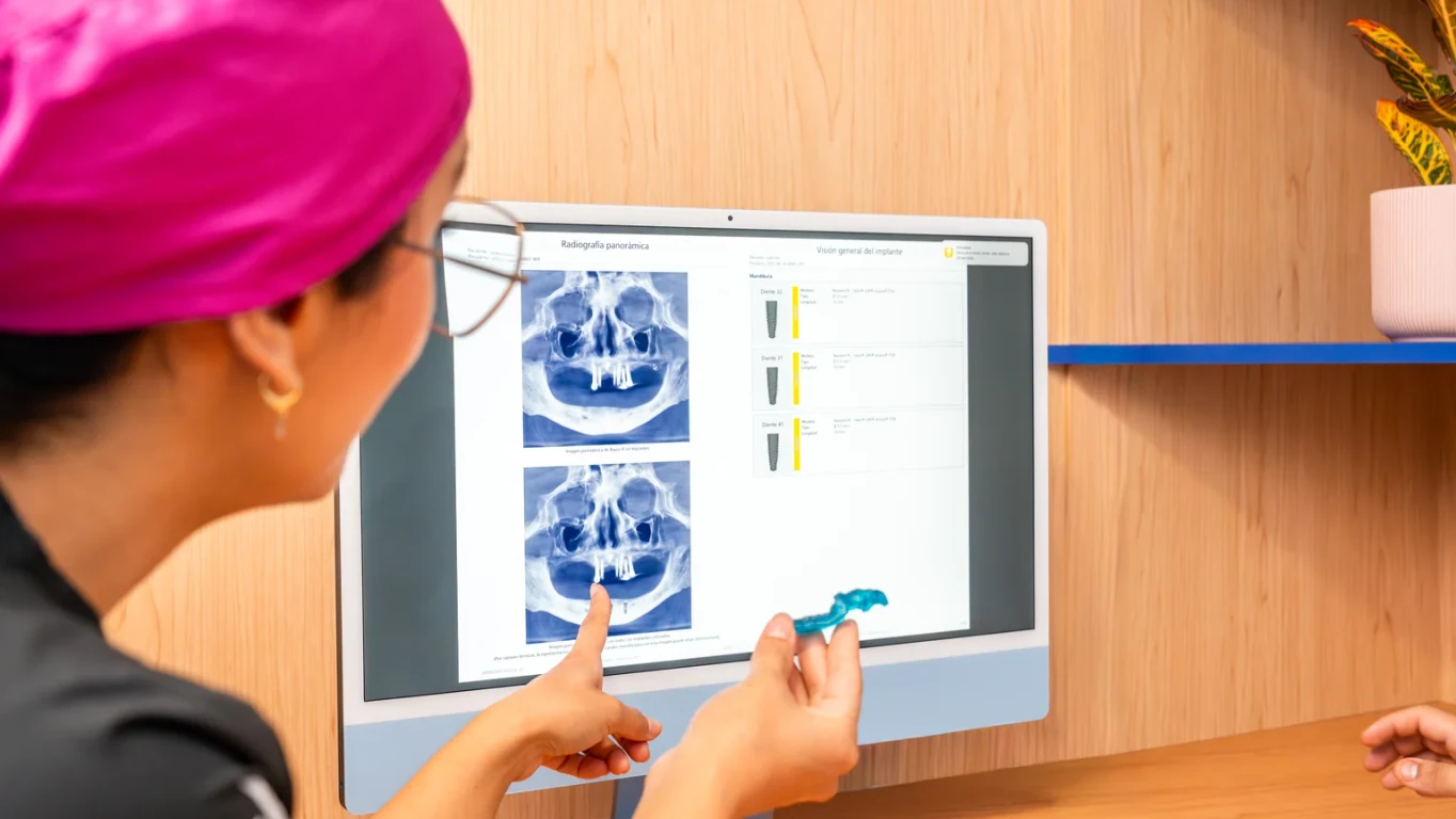 X-ray screen review during dental implant planning at hisonrisa in Mexico City.