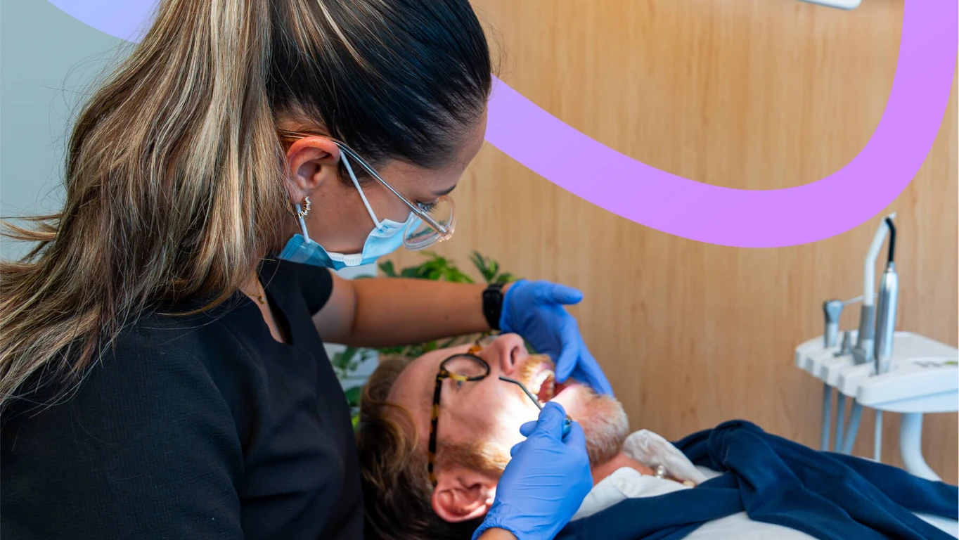 Dentist performing an oral examination in Roma Sur, Mexico City.