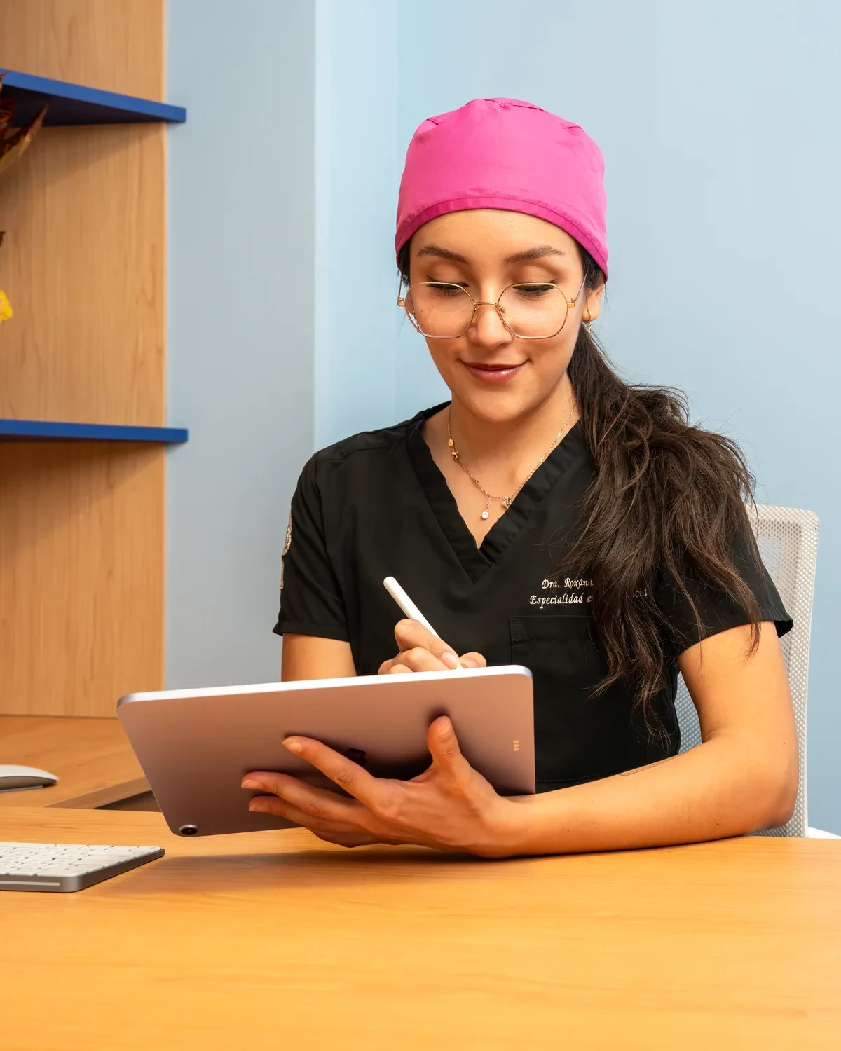 hisonrisa dental clinician reviewing a crown quote on a tablet in Mexico City.