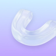 Night guard icon with a protective dental appliance.